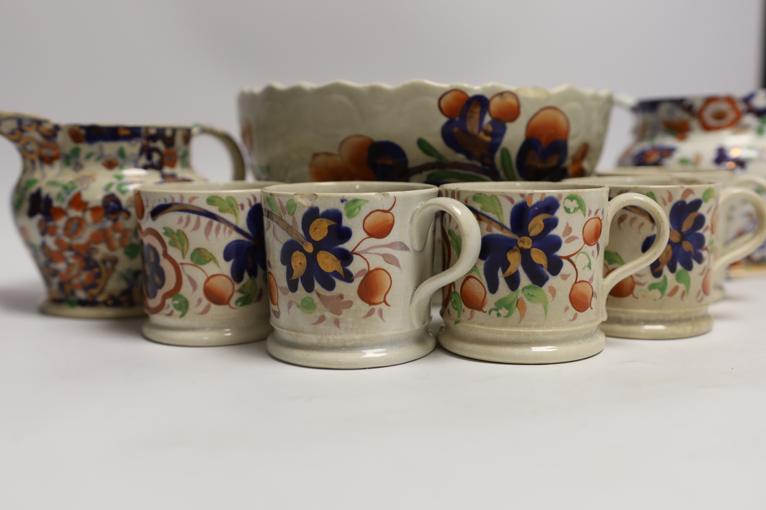 Five Welsh ‘Gaudy’ coffee cans, a large pedestal bowl and two Staffordshire jugs, bowl 21cm diameter
